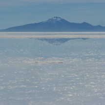 The mirror of Volcano Tunupa in the water on the Salar de Uyuni